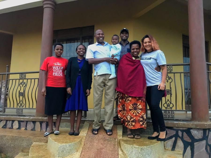 Volunteer with host family in Uganda