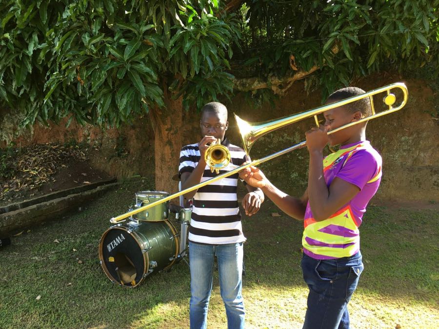 two boys play instruments