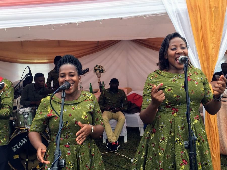 two girls sing