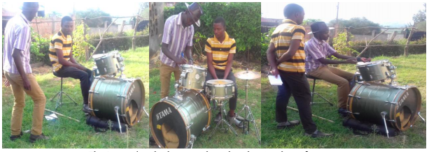 Young man learning to play the drums
