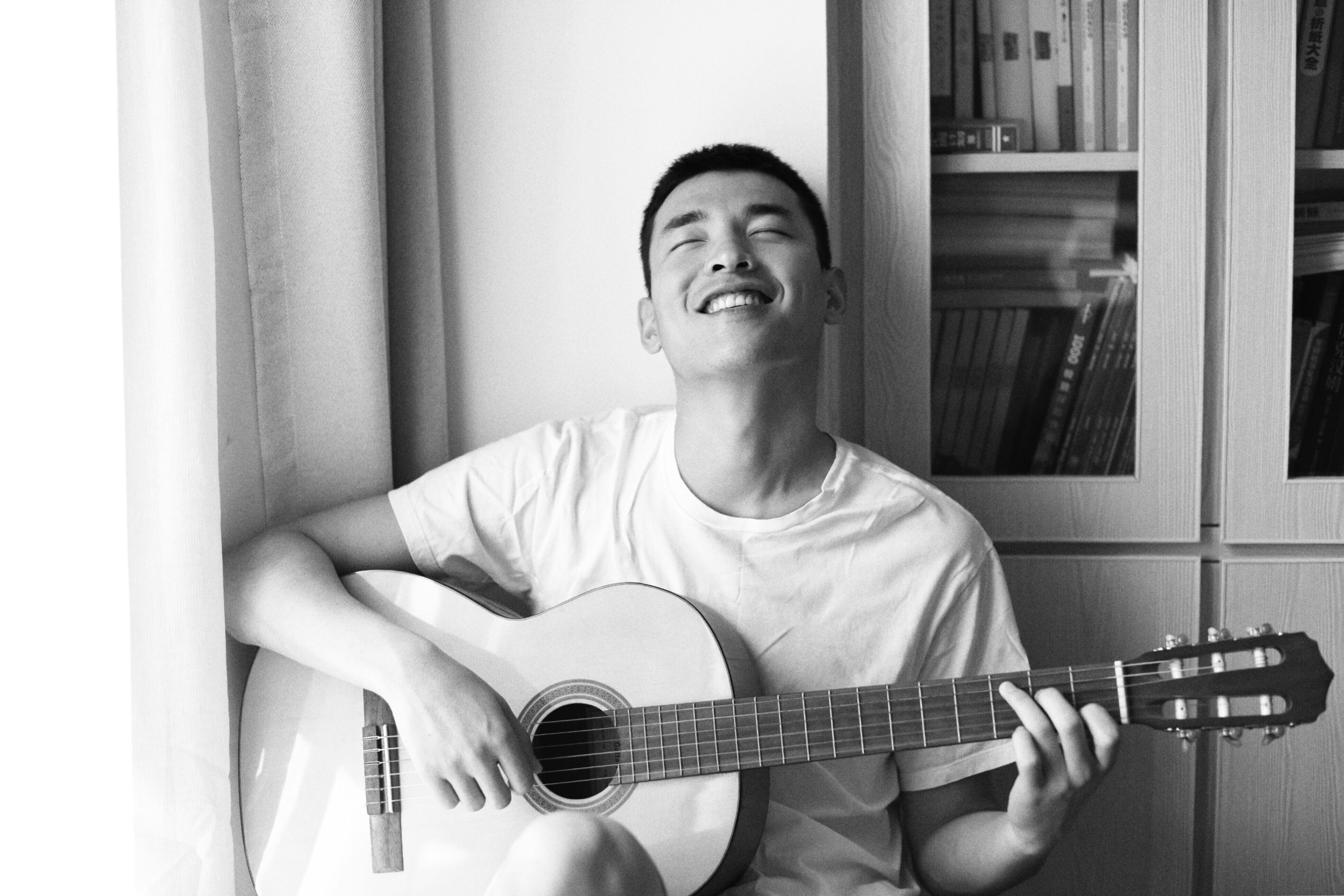 happy man playing guitar
